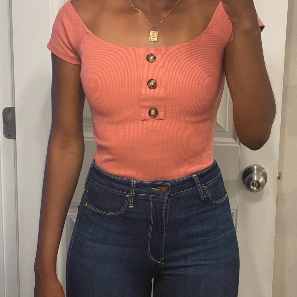Pink button pattern bodysuit